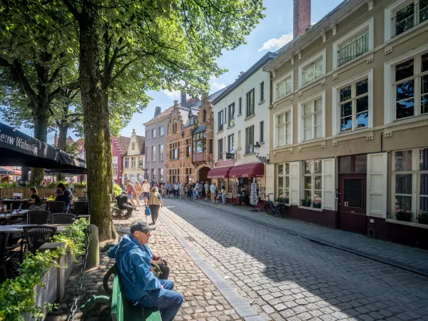 What happens if we are late for our booked private tour in Bruges?