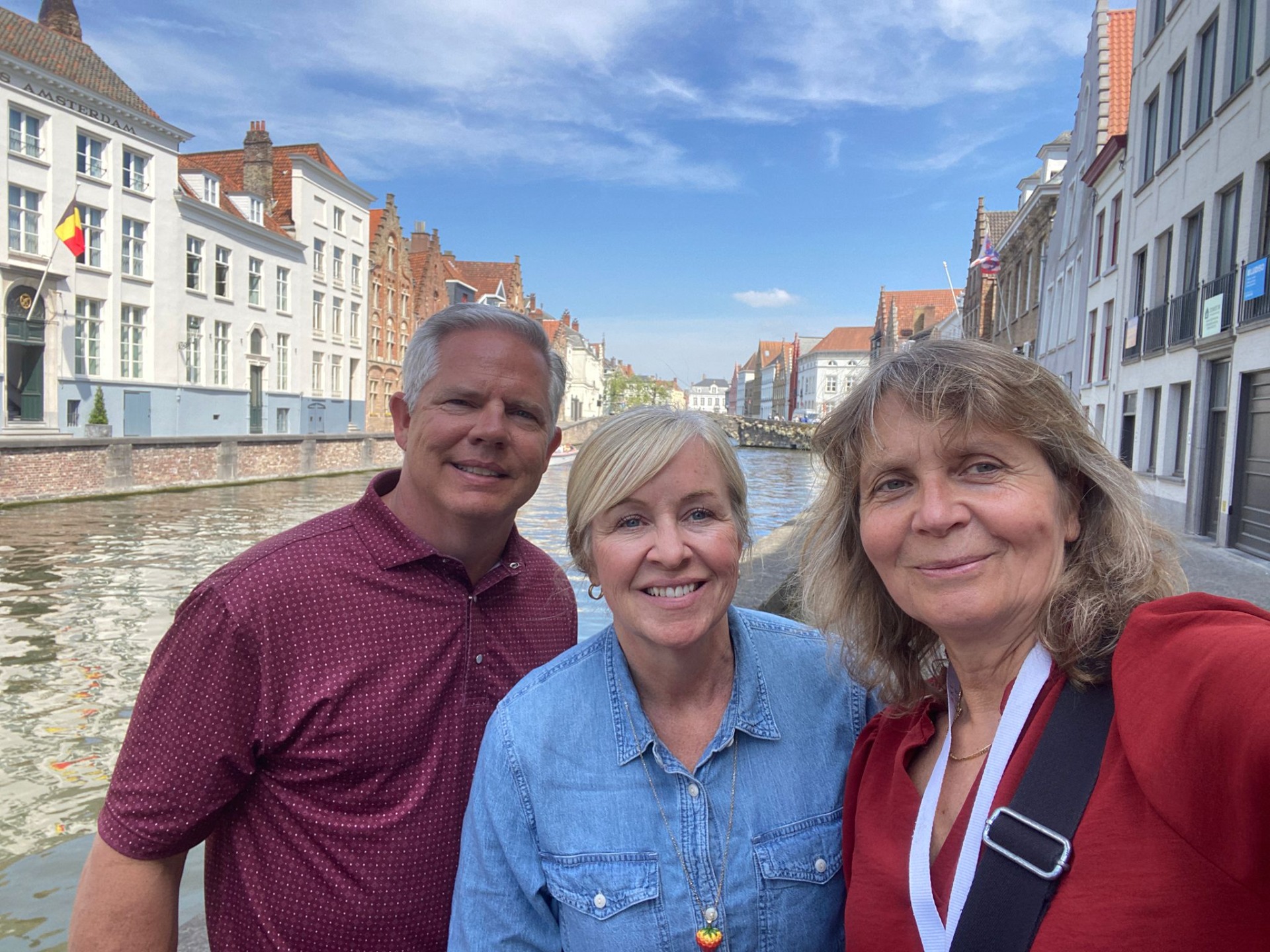 Local tour guide pointing out historical details on a private walking tour in Bruges